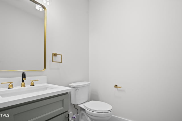 107 Mohave Dr, Louisburg, NC 27549 - half bath featuring toilet, baseboards, and vanity