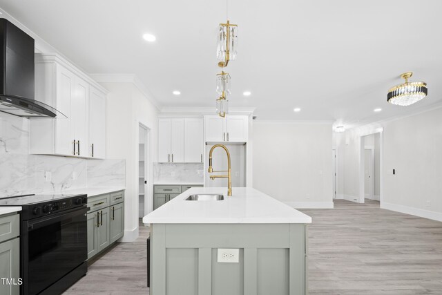 107 Mohave Dr, Louisburg, NC 27549 - kitchen featuring wall chimney exhaust hood, black electric range oven, a sink, crown molding, and recessed lighting