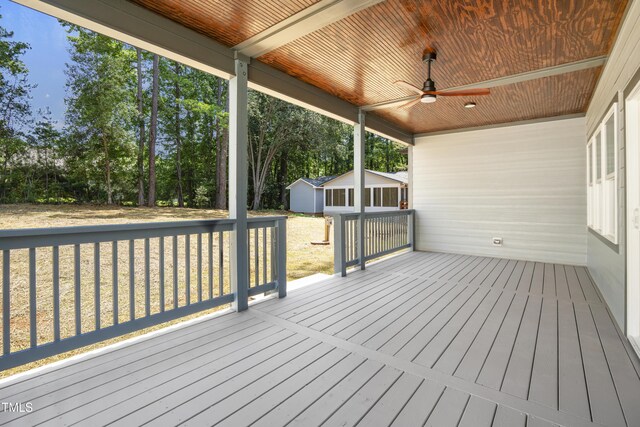 107 Mohave Dr, Louisburg, NC 27549 - wooden deck featuring ceiling fan, an outbuilding, and a lawn