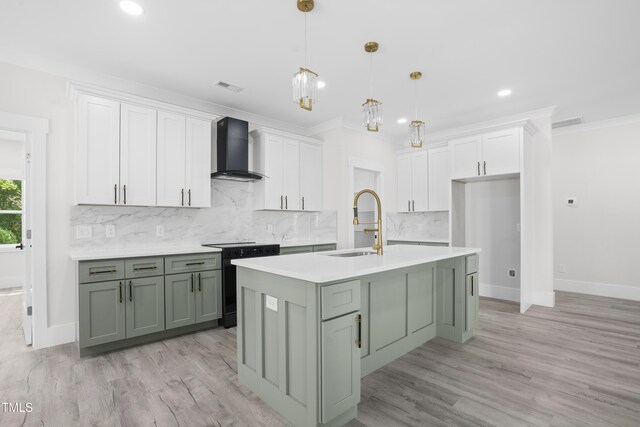 107 Mohave Dr, Louisburg, NC 27549 - kitchen featuring wall chimney range hood, a sink, black range with electric cooktop, decorative backsplash, and white cabinets