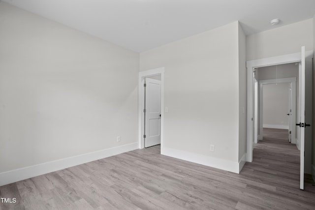 107 Mohave Dr, Louisburg, NC 27549 - empty room with wood finished floors, baseboards, and a smoke detector