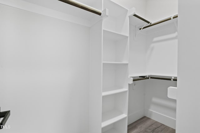 107 Mohave Dr, Louisburg, NC 27549 - walk in closet featuring wood finished floors