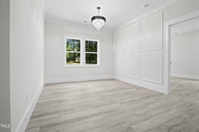 107 Mohave Dr, Louisburg, NC 27549 - unfurnished dining area with a chandelier, light wood-type flooring, baseboards, and crown molding