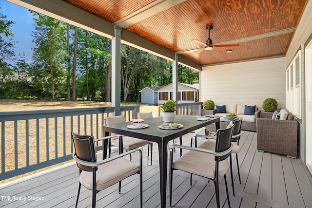 107 Mohave Dr, Louisburg, NC 27549 - deck with a ceiling fan, an outdoor living space, an outbuilding, and outdoor dining area