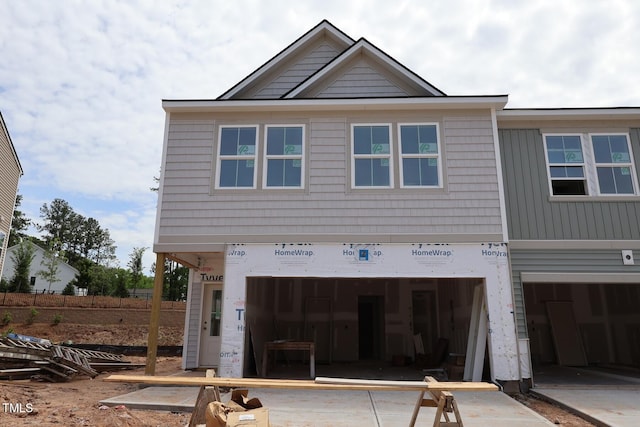 7106 Hubner Pl Unit 44, Cary, NC 27519 - view of front facade featuring an attached garage and concrete driveway