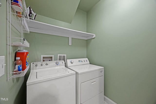 4511 Crab Creek Dr Unit 101, Raleigh, NC 27612 - washroom with washer and clothes dryer and baseboards
