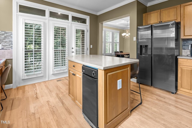 4511 Crab Creek Dr Unit 101, Raleigh, NC 27612 - kitchen featuring stainless steel fridge with ice dispenser, crown molding, backsplash, light wood-style floors, and a chandelier