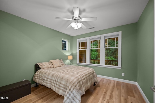 4511 Crab Creek Dr Unit 101, Raleigh, NC 27612 - bedroom with wood finished floors and ceiling fan