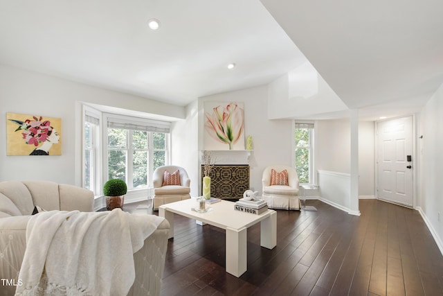 911 Washington St Unit 304, Raleigh, NC 27605 - living area with baseboards, dark wood-style flooring, recessed lighting, vaulted ceiling, and a fireplace