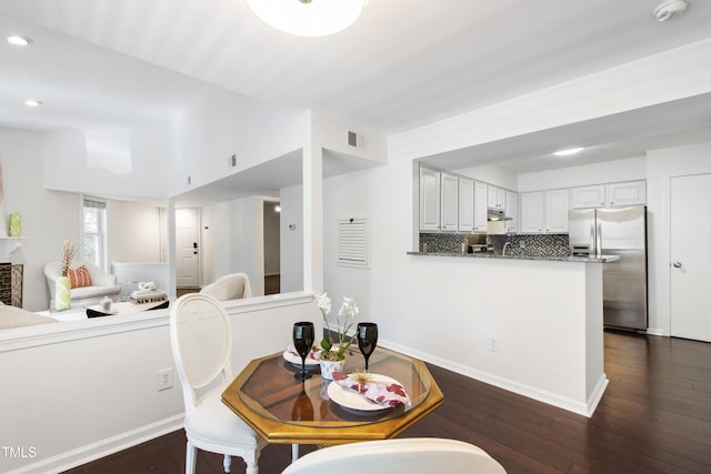 911 Washington St Unit 304, Raleigh, NC 27605 - dining room featuring recessed lighting, dark wood-style flooring, and baseboards