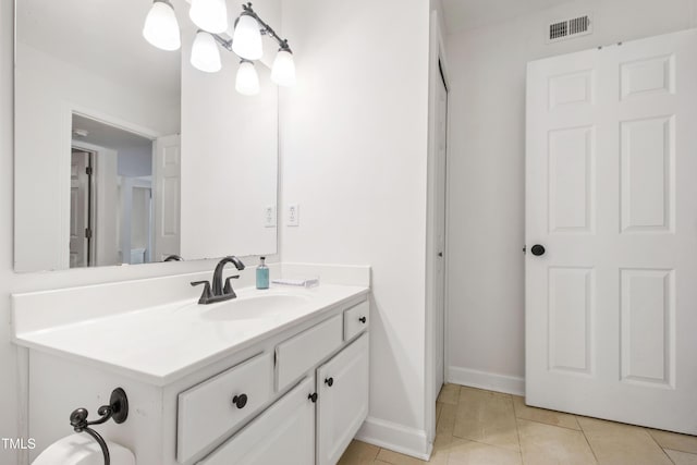 911 Washington St Unit 304, Raleigh, NC 27605 - bathroom with vanity, tile patterned flooring, and baseboards