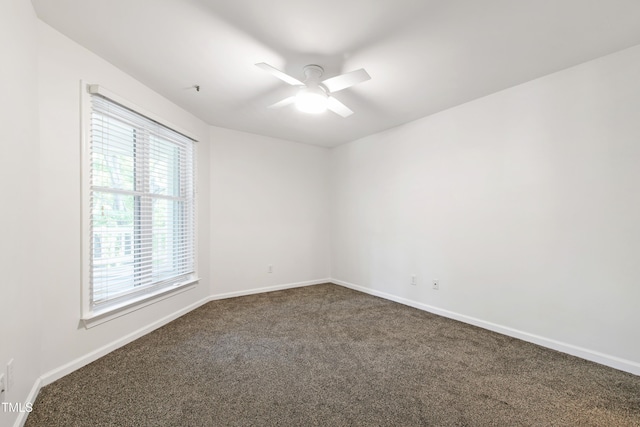 911 Washington St Unit 304, Raleigh, NC 27605 - empty room with dark colored carpet, ceiling fan, and baseboards