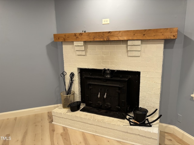 301 Roseland Ave, Durham, NC 27712 - detailed view of a brick fireplace and wood finished floors