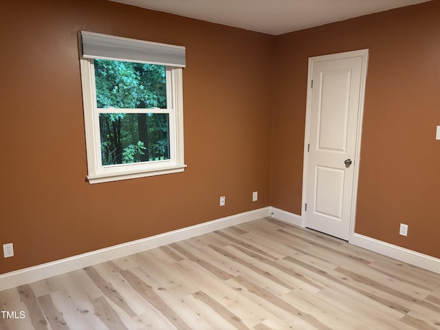 301 Roseland Ave, Durham, NC 27712 - empty room with light wood-style floors and baseboards