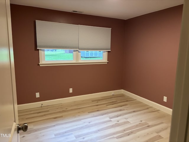 301 Roseland Ave, Durham, NC 27712 - unfurnished room with light wood-style flooring and baseboards