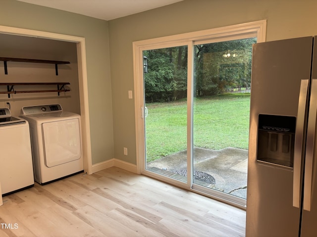 301 Roseland Ave, Durham, NC 27712 - laundry room featuring washer and clothes dryer and light wood-type flooring