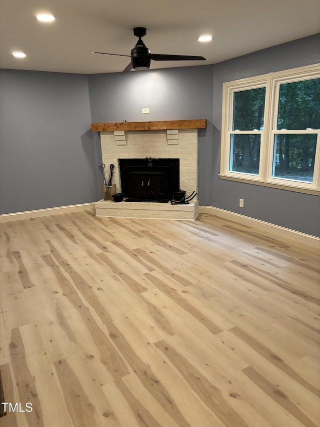 301 Roseland Ave, Durham, NC 27712 - unfurnished living room featuring a ceiling fan, wood finished floors, a fireplace, and recessed lighting