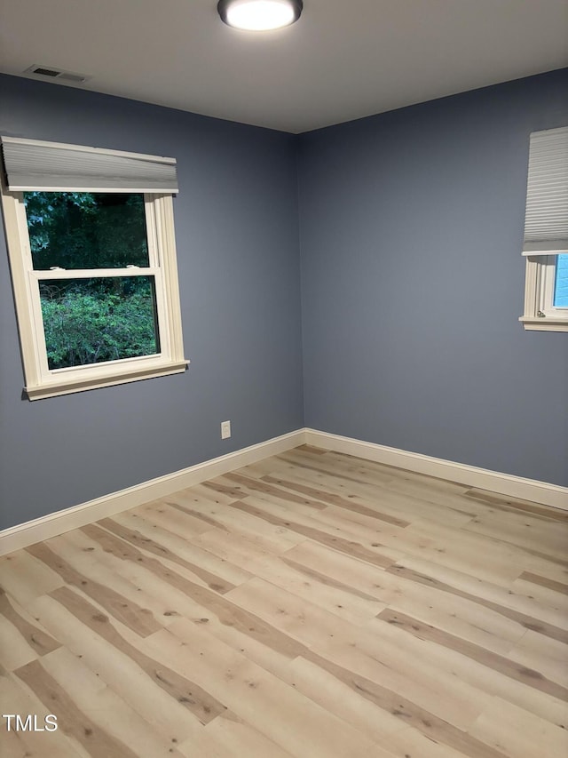 301 Roseland Ave, Durham, NC 27712 - spare room with wood finished floors and baseboards