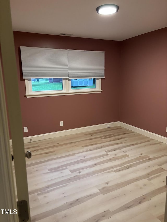 301 Roseland Ave, Durham, NC 27712 - empty room featuring wood finished floors and baseboards
