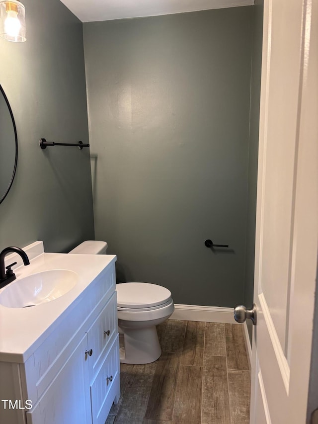301 Roseland Ave, Durham, NC 27712 - half bathroom with wood finished floors and vanity