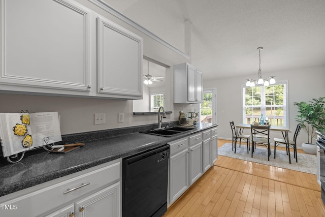 508 Hidden Cellars Dr, Holly Springs, NC 27540 - kitchen with dishwasher, dark countertops, light wood-style flooring, decorative light fixtures, and a chandelier