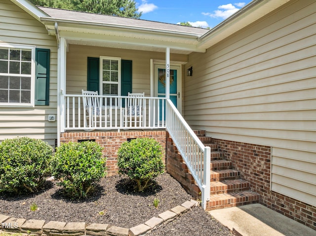 508 Hidden Cellars Dr, Holly Springs, NC 27540 - property entrance featuring covered porch and a shingled roof