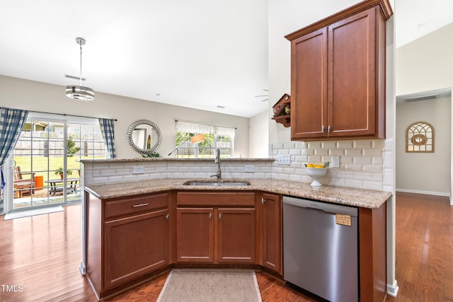 1400 Manley Ct, Fuquay Varina, NC 27526 - kitchen featuring dishwasher, a peninsula, plenty of natural light, and wood finished floors