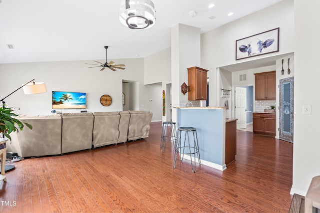 1400 Manley Ct, Fuquay Varina, NC 27526 - living room with high vaulted ceiling, dark wood-type flooring, ceiling fan, and recessed lighting