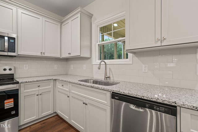 156 Harmony Trl, Broadway, NC 27505 - kitchen with appliances with stainless steel finishes, a sink, decorative backsplash, and light stone countertops