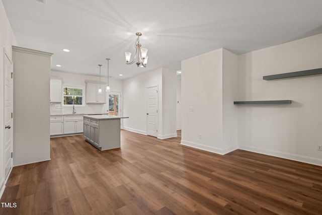 156 Harmony Trl, Broadway, NC 27505 - kitchen featuring a center island, dark wood-style flooring, a sink, recessed lighting, and baseboards