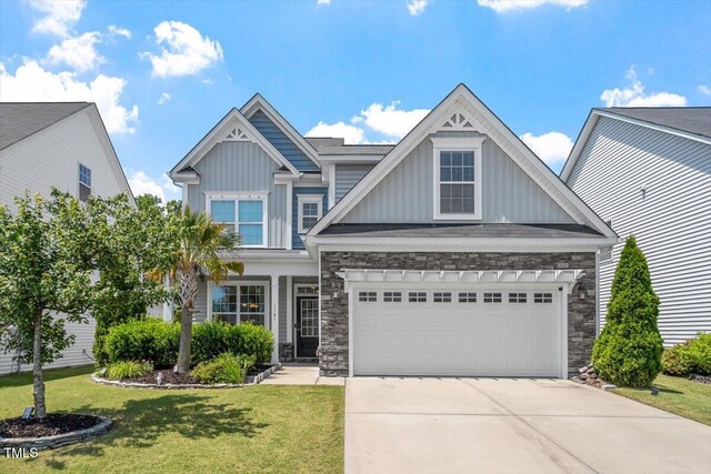 1161 Tulip Poplar Rd, Fuquay Varina, NC 27526 - craftsman-style home featuring stone siding, board and batten siding, and driveway