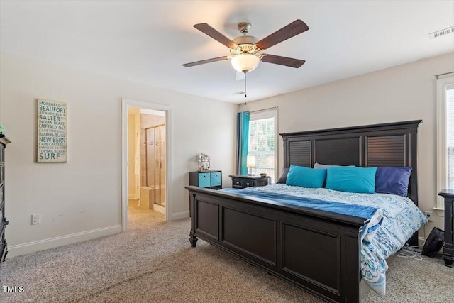 1161 Tulip Poplar Rd, Fuquay Varina, NC 27526 - bedroom with light colored carpet, baseboards, a ceiling fan, and connected bathroom