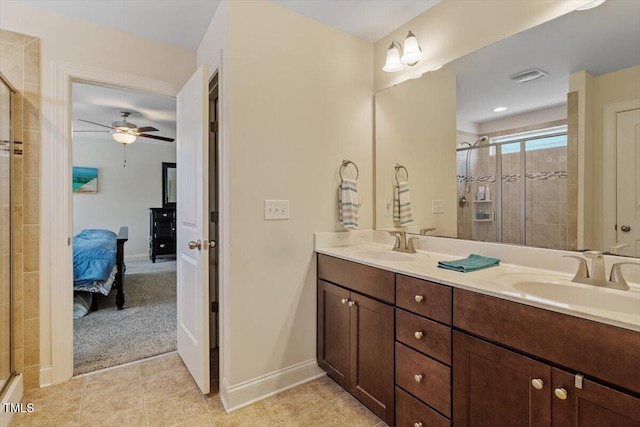 1161 Tulip Poplar Rd, Fuquay Varina, NC 27526 - bathroom featuring ensuite bathroom, a stall shower, a ceiling fan, double vanity, and baseboards