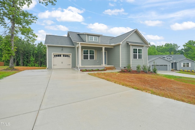 147 Harmony Trl, Broadway, NC 27505 - view of front of house featuring concrete driveway, an attached garage, a porch, and crawl space
