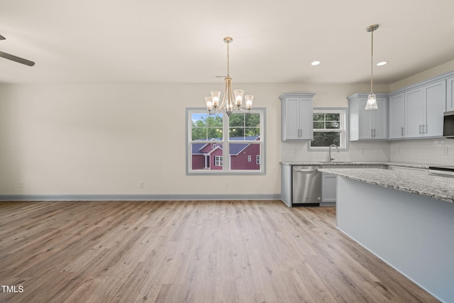 147 Harmony Trl, Broadway, NC 27505 - kitchen featuring dishwasher, light wood finished floors, decorative backsplash, gray cabinetry, and light stone counters