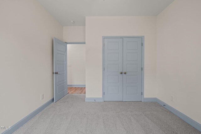 147 Harmony Trl, Broadway, NC 27505 - unfurnished bedroom featuring carpet, baseboards, and a closet
