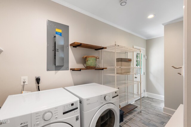 3934 Hope Valley Rd, Durham, NC 27707 - washroom featuring separate washer and dryer, baseboards, electric panel, light wood-style flooring, and crown molding