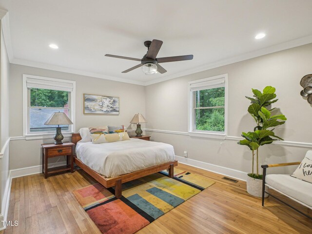 3934 Hope Valley Rd, Durham, NC 27707 - bedroom with light wood-type flooring, multiple windows, baseboards, crown molding, and recessed lighting