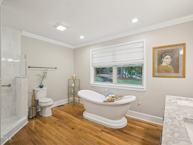 3934 Hope Valley Rd, Durham, NC 27707 - bathroom with wood finished floors, a soaking tub, crown molding, baseboards, and a tile shower
