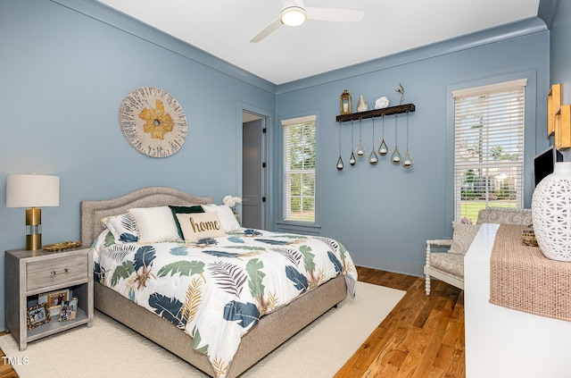 2328 Sanctuary Dr, Raleigh, NC 27606 - bedroom with wood finished floors and a ceiling fan