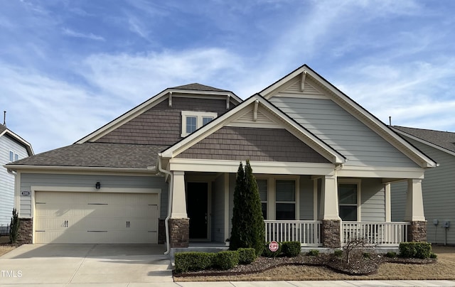 1205 Steinbeck Dr, Durham, NC 27703 - craftsman inspired home with covered porch, a garage, concrete driveway, stone siding, and a shingled roof