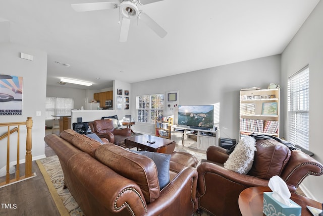 2910 Barrymore St Unit 100, Raleigh, NC 27603 - living area with wood finished floors, baseboards, and ceiling fan