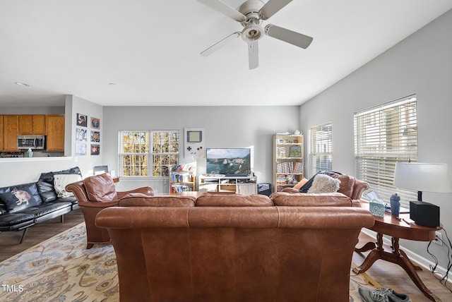 2910 Barrymore St Unit 100, Raleigh, NC 27603 - living room featuring a ceiling fan, light wood finished floors, and baseboards