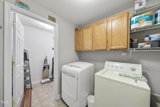 2910 Barrymore St Unit 100, Raleigh, NC 27603 - laundry area with washer and clothes dryer, cabinet space, and baseboards