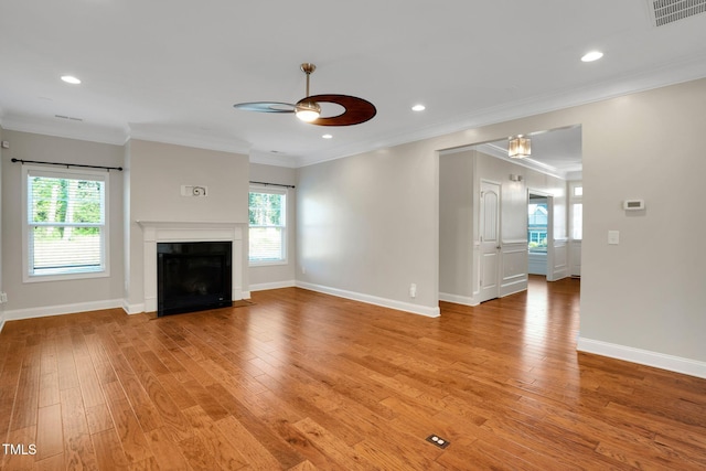 20 Sugarpine Trl, Clayton, NC 27520 - unfurnished living room with ceiling fan, light wood finished floors, a fireplace with flush hearth, baseboards, and crown molding