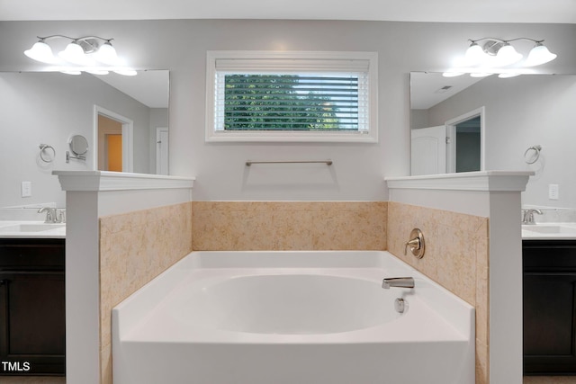20 Sugarpine Trl, Clayton, NC 27520 - bathroom with two vanities and a bath