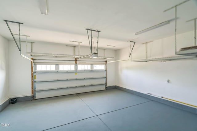 20 Sugarpine Trl, Clayton, NC 27520 - garage with baseboards and a garage door opener