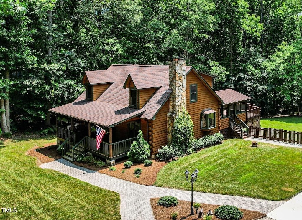 2416 Kearney Rd, Wake Forest, NC 27587 - view of front of property featuring log siding, a porch, stairway, a chimney, and a sunroom