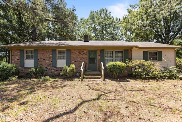 4038 Redwood Rd, Durham, NC 27704 - view of front of home with a chimney and brick siding