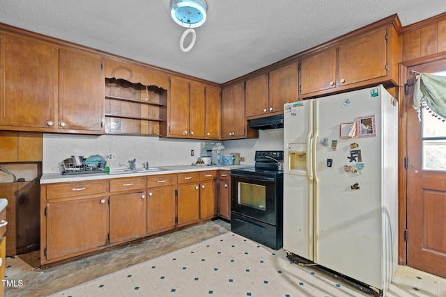 4038 Redwood Rd, Durham, NC 27704 - kitchen with white fridge with ice dispenser, electric range, under cabinet range hood, brown cabinets, and a textured ceiling